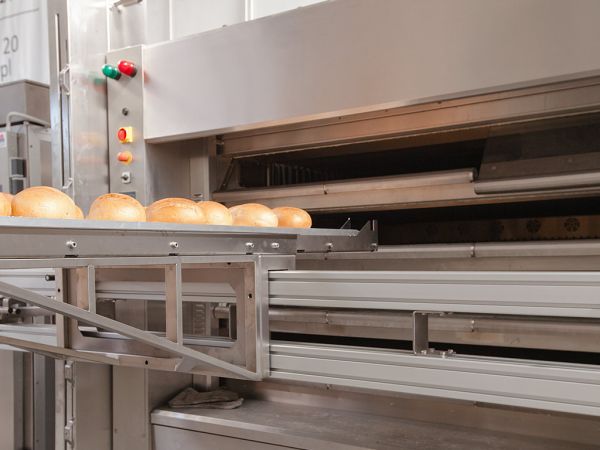 Loading bread into oven