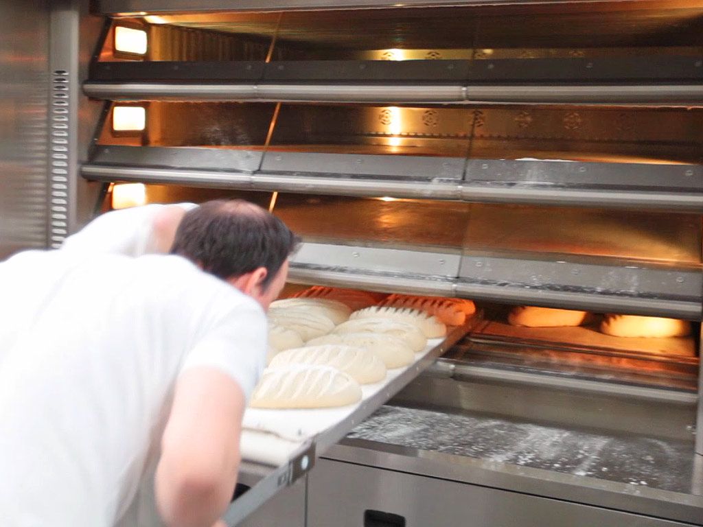 loading-bread-into-oven